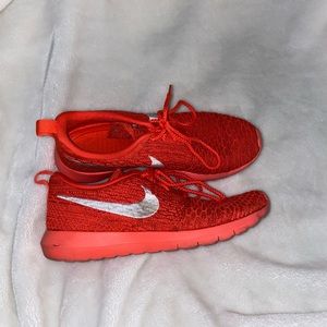 Red-orange Nike knit sneakers